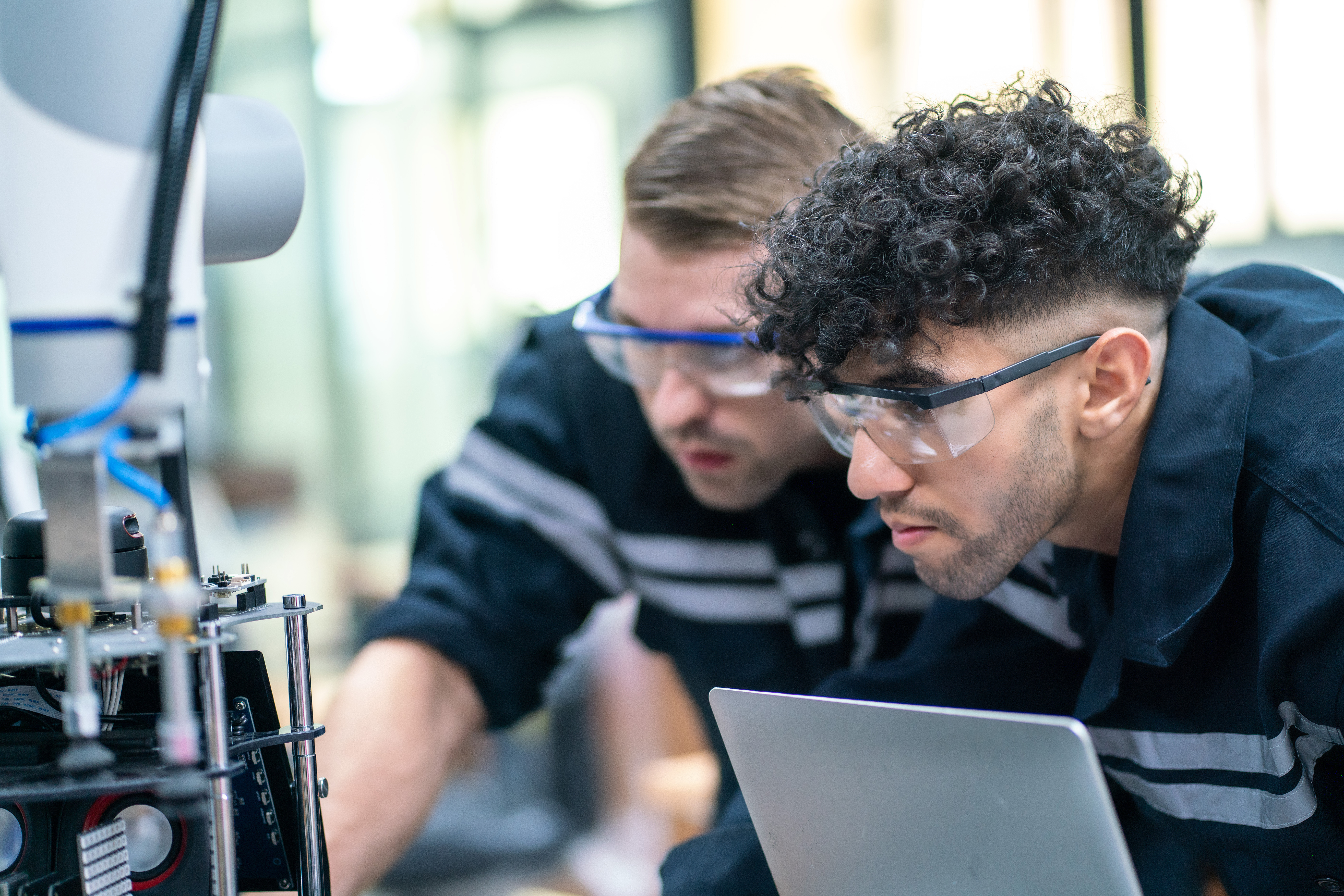 Mechanical engineering team working in robotic technology lap fo